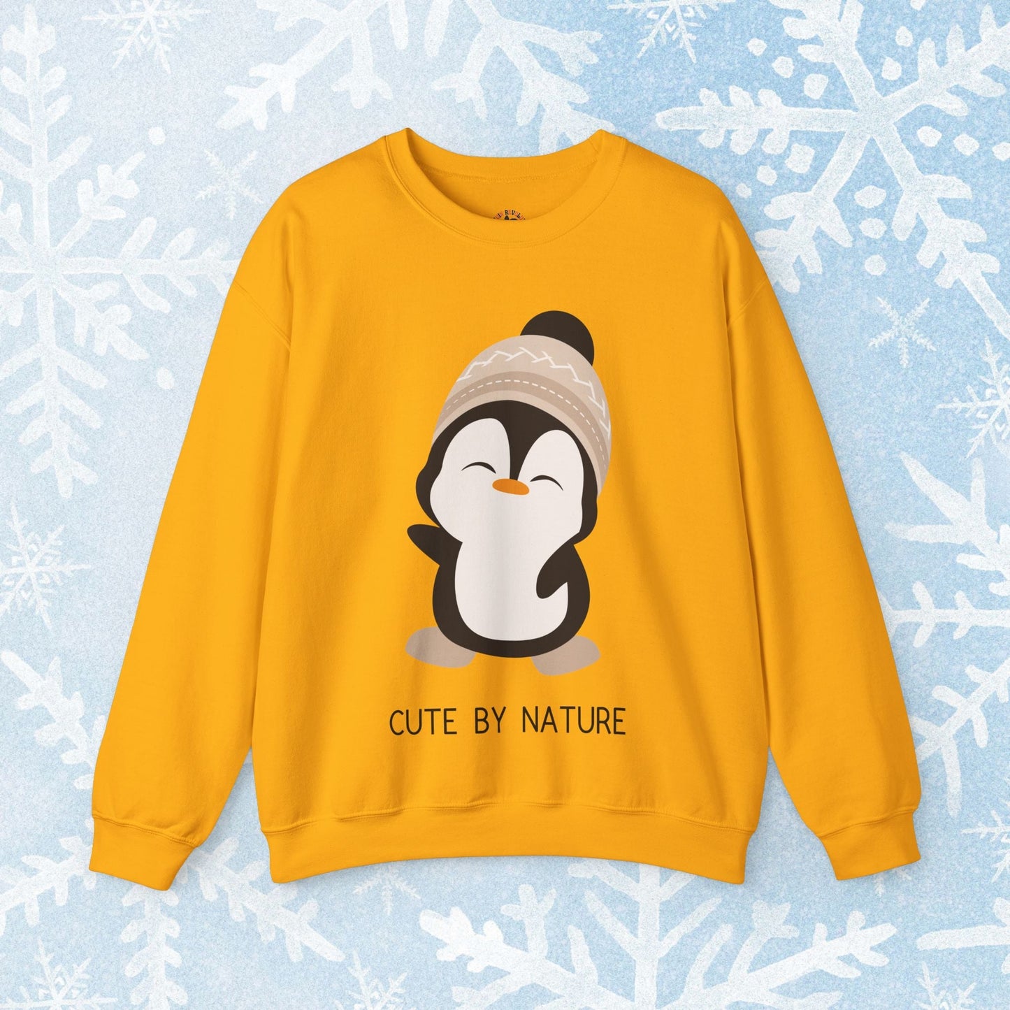 Cute Penguin Sweatshirt - Unisex Heavy Blend™ Crewneck, Cute by Nature, big cute winter penguin design, underneath a text "cute by nature"