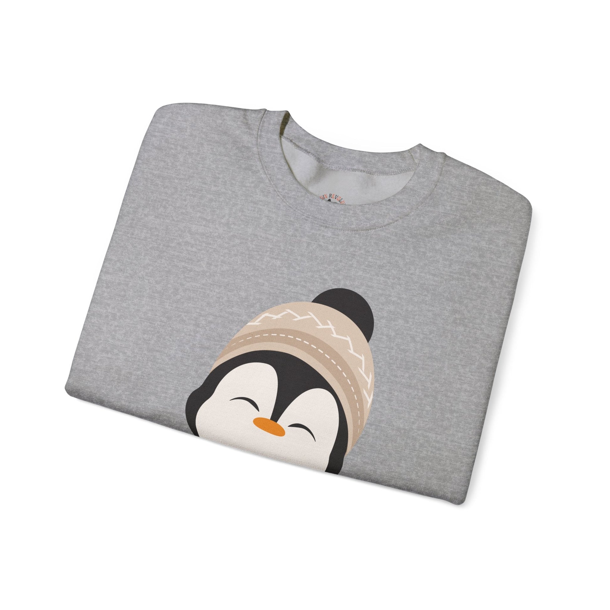 Cute Penguin Sweatshirt - Unisex Heavy Blend™ Crewneck, Cute by Nature, big cute winter penguin design, underneath a text "cute by nature"