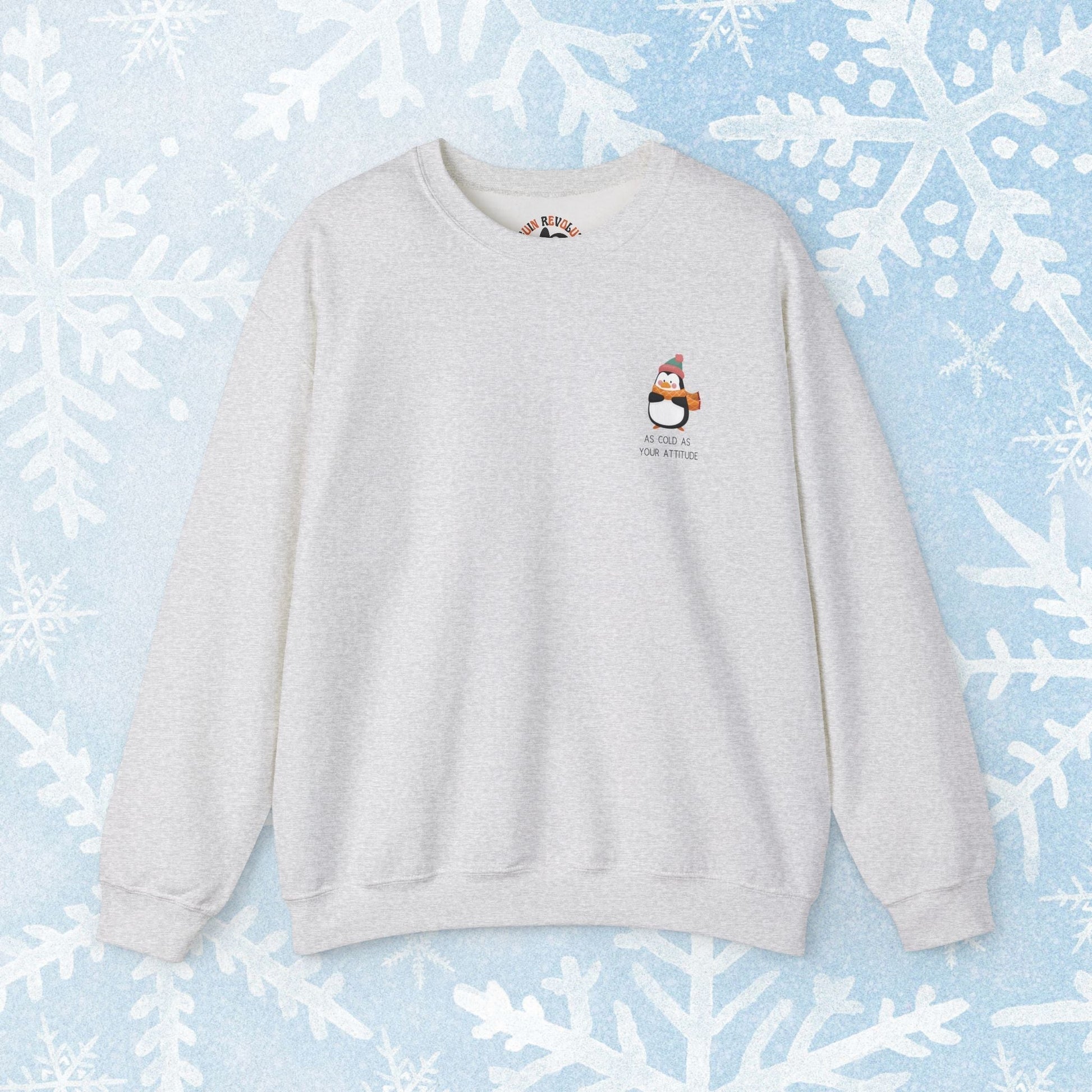 Funny Winter Sweatshirt - Penguin with an Attitude, Unisex Sweatshirt. Small Penguin design on the side with winter clothing, and text 'as cold as your attitude'