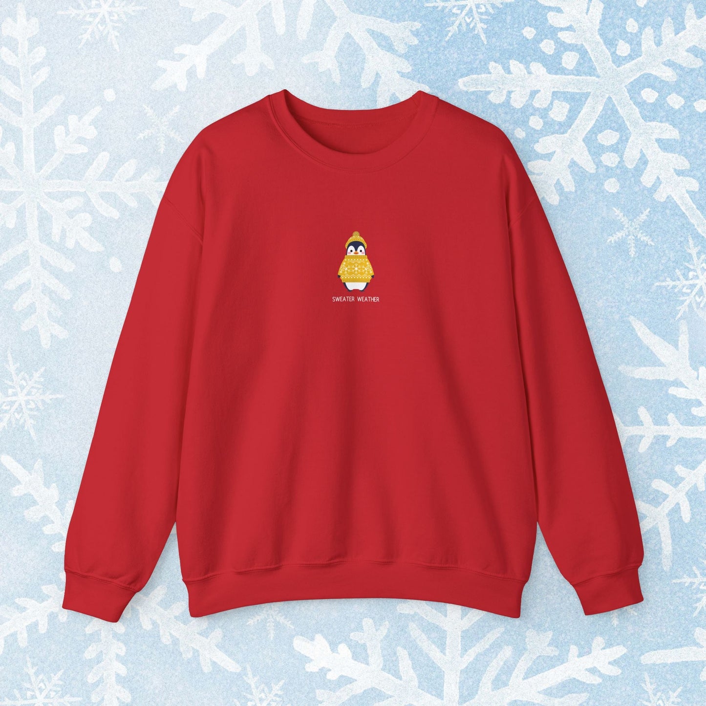 Sweater Weather Unisex Crewneck Sweatshirt - Staying Warm and Fuzzy. Small centered Penguin design wearing a yellow Sweater with text under "sweater weater"