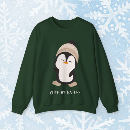 Cute Penguin Sweatshirt - Unisex Heavy Blend™ Crewneck, Cute by Nature, big cute winter penguin design, underneath a text "cute by nature"