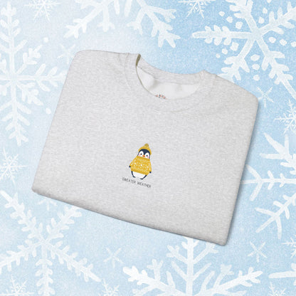 Sweater Weather Unisex Crewneck Sweatshirt - Staying Warm and Fuzzy. Small centered Penguin design wearing a yellow Sweater with text under "sweater weater"