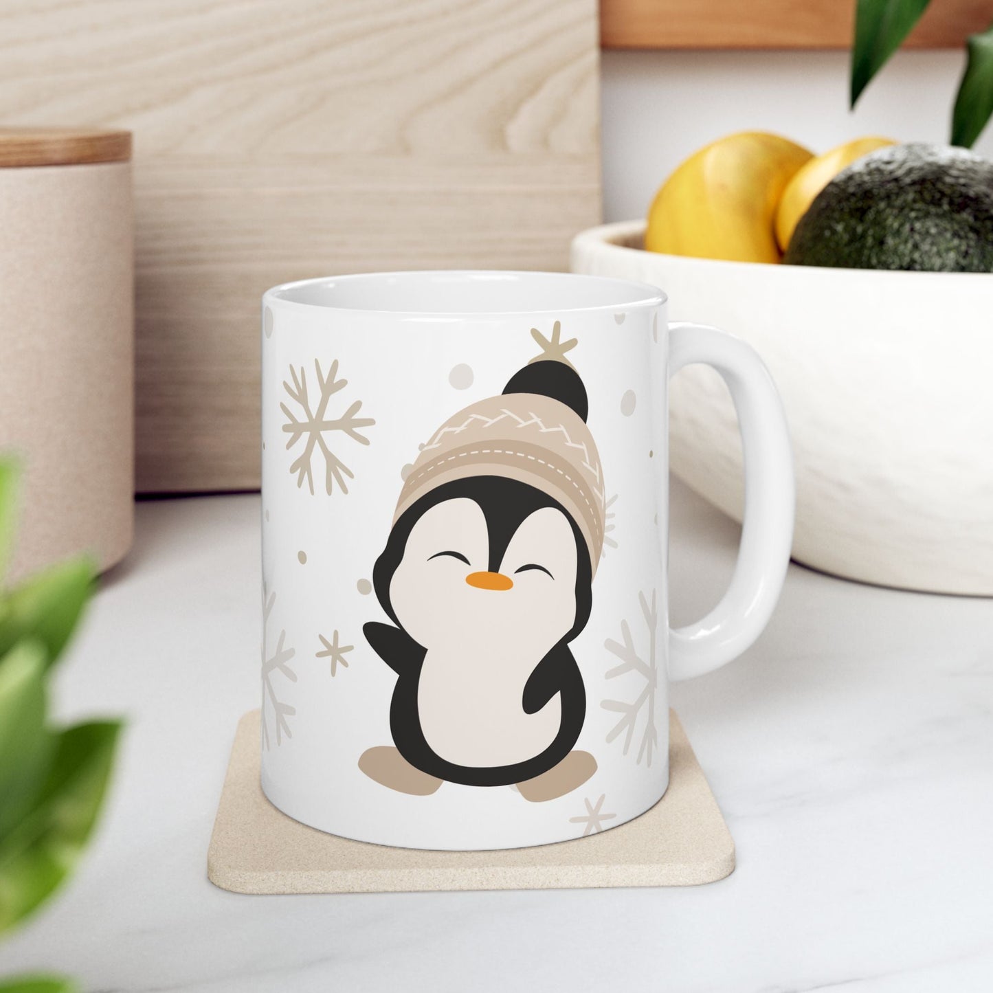 Penguin Mug - Cute Ceramic white mug with a cute penguin design wearing a winter hat. On the other side of the mug there is a text saying "Cute by nature".