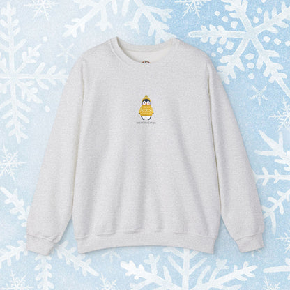 Sweater Weather Unisex Crewneck Sweatshirt - Staying Warm and Fuzzy. Small centered Penguin design wearing a yellow Sweater with text under "sweater weater"