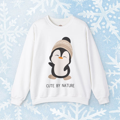 Cute Penguin Sweatshirt - Unisex Heavy Blend™ Crewneck, Cute by Nature, big cute winter penguin design, underneath a text "cute by nature"